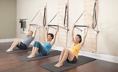 Pilates Springboard(TM) and Push-Through Bar (Red resistance springs)